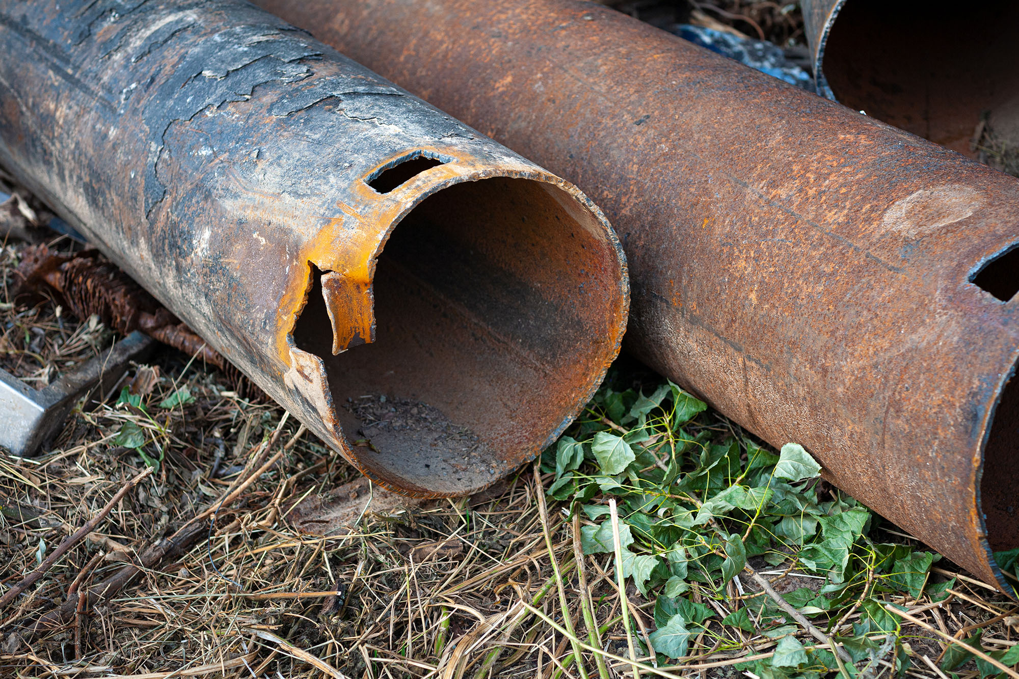Metal erosion being shown through heavily eroded pipes