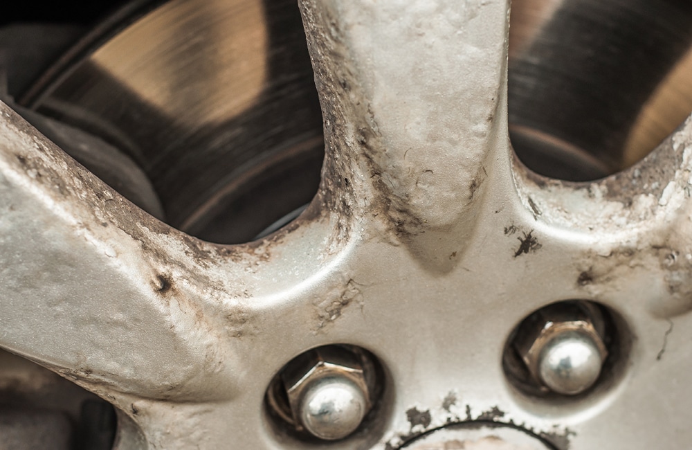 Filiform corrosion on a silver aluminum alloy wheel.