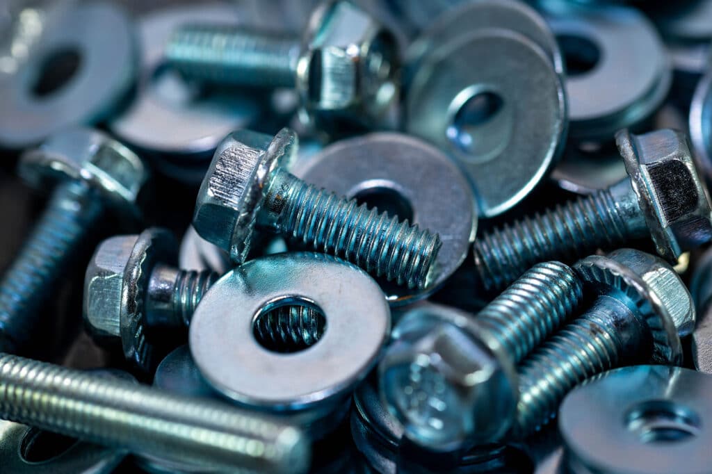 A picture that shows a pile of bolts, washers, and nuts.