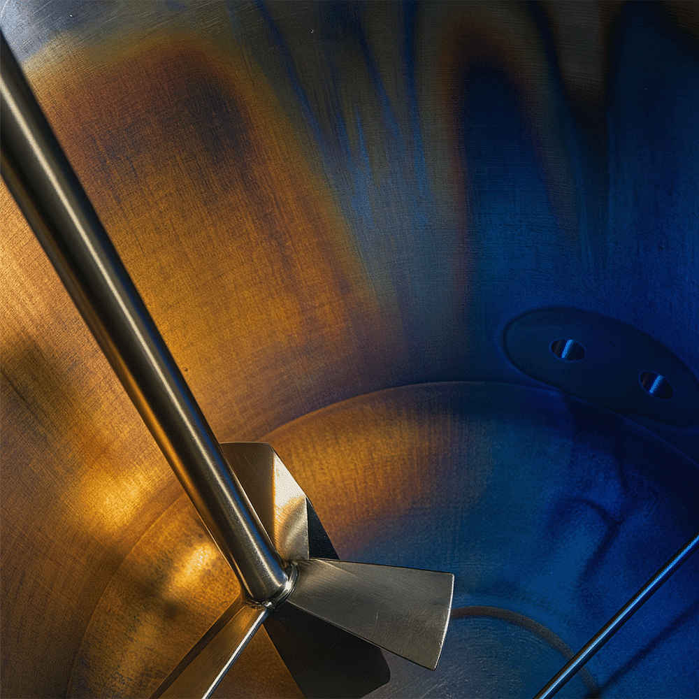 metal rouging is seen in a production vat in blue and yellow-orange hues