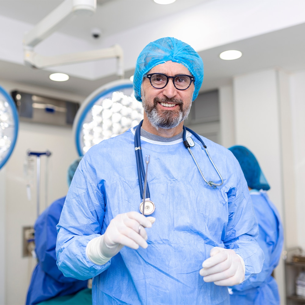 A surgeon posing with an me-92 chromium coated surgical device