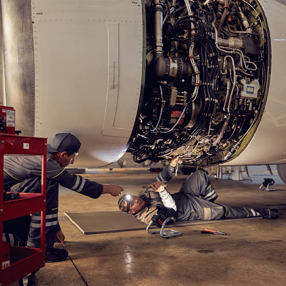 aircraft mechanic inspecting aerospace engine components