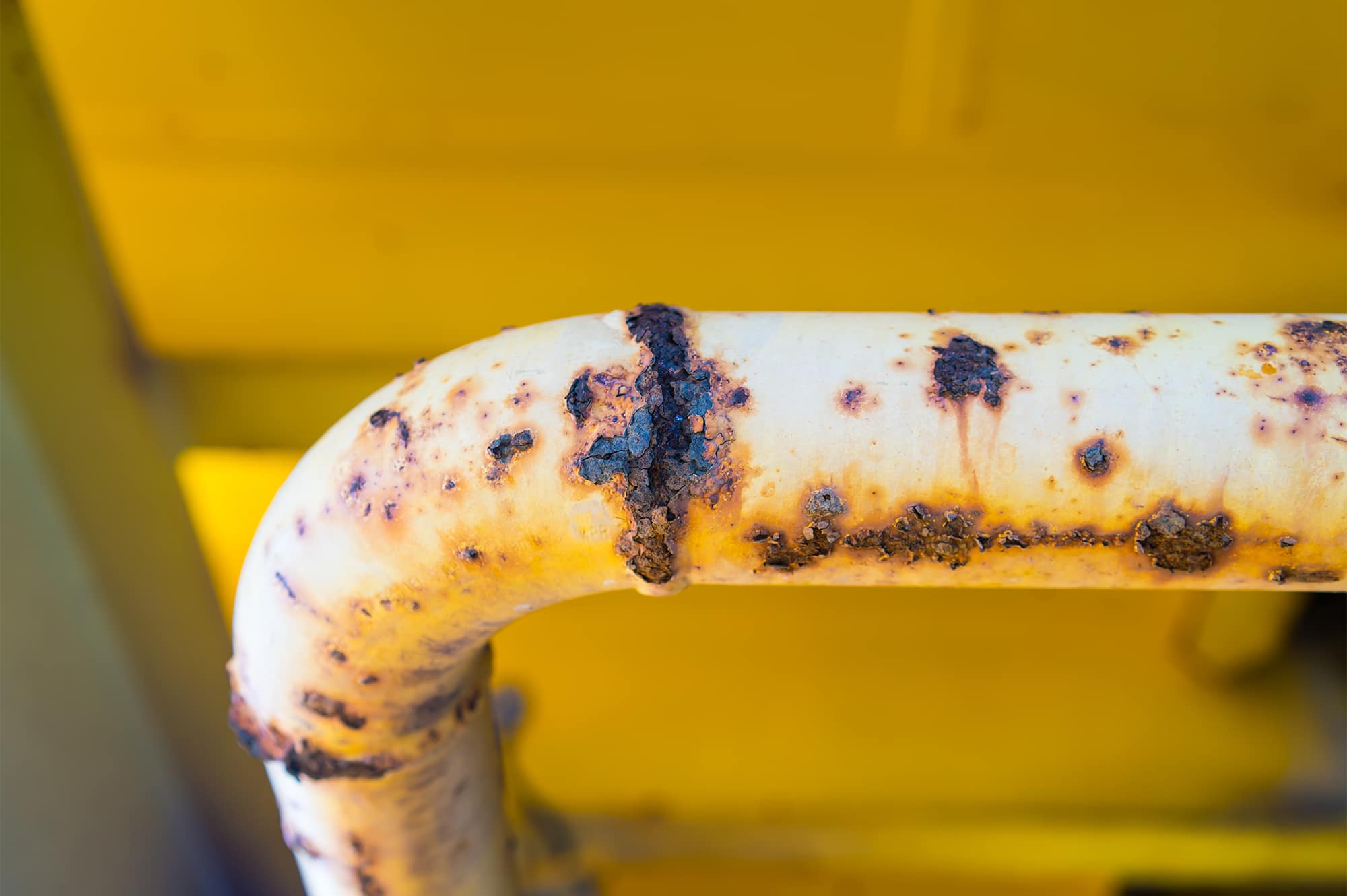 An image of a pipe that is badly corroded